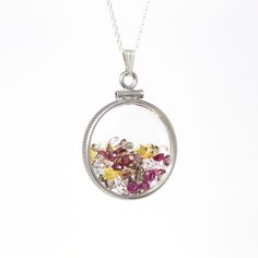 "Autumn inspired handcrafted brand new sterling silver multi-gem shaker locket! This statement pendant is nickel sized with coin style bezels, and clear lucite covers. The round charm hangs from a brand new sterling silver chain, and is filled with a mixture of genuine rubies, white topaz, and yellow sapphires. A fall inspired piece of brand new jewelry, featuring July's birthstones! ERA - New METAL / MATERIAL - Sterling silver locket & chain, lucite clear covers, 1 screw (can be opened and Sterling Silver Medallion With Birthstone Jewelry, Heirloom Style Sterling Silver Nickel-free Jewelry, Heirloom Style Round Sterling Silver Jewelry, Handmade Heirloom Necklace, Handmade Heirloom Round Necklace, Heirloom Handmade Round Necklace, Handmade Heirloom Necklace With Round Pendant, Heirloom Style Nickel-free Sterling Silver Jewelry, Heirloom Handmade Round Pendant Necklace