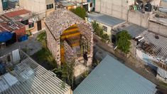 an aerial view of some buildings and rooftops