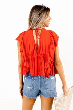 Slay all day in our cute scarlet colored 'Believe The Dream' top featuring lightweight material, a button down front, a v-cut neckline and upper back with a tie closure, ruffled short sleeves that continued down the sides, and a flattering silhouette that falls into a straight peplum hemline! on products Measurements S : Bust 36", Hip 40", Length 19", Sleeve Length 5", Waist 34". M : Bust 38", Hip 42", Length 19.5", Sleeve Length 5", Waist 36". L : Bust 40", Hip 44", Length 19.5", Sleeve Length Slay All Day, Ruffle Shorts, V Cut, V Cuts, The Dream, Scarlet, Peplum Top, Short Sleeves, Sleeve Length