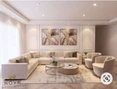 an elegant living room with white furniture and large paintings on the wall behind the couches