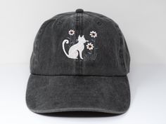 Item: Cat and flower embroidered baseball cap with curved brim Material: 100% cotton Size: one size fits most with adjustable back strap Embroidery: machine embroidered I am also open for customization. If you want the item in different colors, please message me, it will take additional 2-3 days of handling time. Free first class shipping, upgradable priority mail service. 30 days return policy, feel confident at your purchase! Adjustable Cotton Baseball Cap With Custom Embroidery, Adjustable Cotton Dad Hat With Embroidery, Adjustable Cotton Baseball Cap With Embroidery, Adjustable Cotton Trucker Hat With Embroidered Patch, Adjustable Hats With Custom Embroidery And Curved Bill, Custom Embroidery Adjustable Baseball Cap With Curved Bill, Adjustable Curved Bill Hat With Custom Embroidery, Adjustable Hat With Embroidered Patch And Curved Bill, Adjustable Hats With Embroidered Patch And Curved Brim