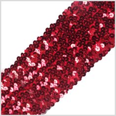 red sequinized ribbon on white background