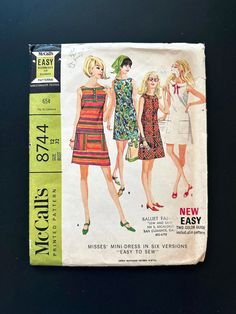 an old fashion sewing book with two women's dresses