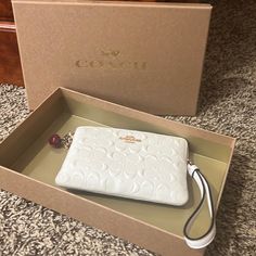 Never Used Has Tags And Originally Boxing White Rectangular Case Clutch For Gift, White Rectangular Case Clutch As Gift, Beige Clutch With Wrist Strap For Gift, Beige Clutch With Wrist Strap As Gift, White Rectangular Clutch For Gifts, White Rectangular Clutch As Gift, Rectangular White Clutch As Gift, Coach Rectangular Wristlet For Gift, Coach Rectangular Wristlet As Gift