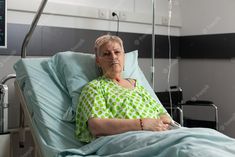 an older woman laying in a hospital bed