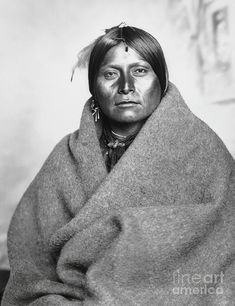 an old photo of a native american woman