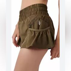 Nwot Free People Movement High Rise Get Your Flirt On Shorts So Flirty And Fun Shorts To Spice Up Your Workout Attire, Featured In A Flowy Style With A High-Rise, Smocked Waistband And Side Pockets. Pull-On Style Elastic Waistband Side Pleated Accents Care + Content Machine Wash Cold Import 100% Polyester Color: Dark Olive Green Size: X-Small Make An Offer Casual Yoga Skort Short Length, Casual Summer Yoga Skort, Yoga Bottoms With Pockets, Short Yoga Bottoms With Side Pockets, High Waist Athletic Shorts With Pockets For Spring, Casual Yoga Skort With Elastic Waistband, Casual Short Skort With Wide Waistband, Stretch High-waisted Shorts With Pockets, Stretch Summer Shorts With Pockets