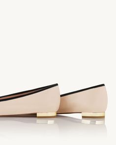 An ode to inimitable French elegance, the Parisina Ballet pumps will never go out of style. Versatile and comfortable, they're crafted from supple, 'Light Nude' nappa leather with a unique high-shine finish that creates a chic contrast with black grosgrain toe caps. Topped with dainty bows, they're the ones you'll come back to time and again. Slip on Metallic flat heel Special gloss finish Padded leather insole Signature logo detailing Material: NAPPA LEATHER Heel Height: 10 mm Made in: Italy Luxury Calf Leather Ballet Flats For Spring, Formal Beige Ballet Flats With Leather Sole, Elegant Calf Leather Ballet Flats, Elegant Medium Width Slip-on Ballet Flats, Chic Leather Shoes With Contrasting Heel Counter, Chic Beige Ballet Flats With Leather Sole, Elegant Beige Slip-on Court Shoes, Elegant Beige Leather Shoes With Pointed Toe, Elegant Leather Shoes With Contrasting Heel