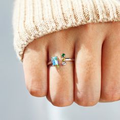 This personalized 1-5 kids birthstones ring for family is a perfect gift for a mother or grandmother, or for anyone who wants a reminder of their loved ones! It's fun to choose from 1 stone, 2 stones, 3 stones, 4 stones or 5 colored stones to represent all of the loved ones on Mother's day. Kids Birthstone Ring, Stackable Rings With May Birthstone For Birthday, Stackable May Birthstone Ring For Birthday, May Birthstone Stackable Ring For Birthday, May Birthstone Promise Ring With Open Design, Birthstone Rings For Mother's Day Gift, Mother's Day Gift Birthstone Ring In Sterling Silver, Mother's Day Gift Rings With Birthstone, Mother's Day Birthstone Rings As Gifts