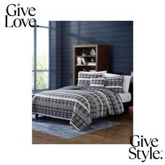 a bed in a room with blue walls and wooden floors, has a plaid comforter set on it