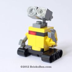 there is a lego robot with two lights on it's head and one eye open