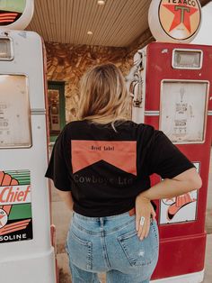 Our Midnight Cowboys Ltd T Shirt, Nashville Outfit, Country Concert Top, Western Tee Dress, Let's Go Girls , Rodeo Shirt, Cowgirl Shirt You know the girls who always look like they're off to a music festival? These are the clothes they wear ✊ Our Cowboys Ltd T Shirt Concert Dress / T Shirt is semi cropped for the ultimate Stagecoach or Nashville look! Features chevron with saying on chest on front and the same design on the back---but larger ✊ Pair it with one of our brims, statement necklaces, Outfit Country Concert, Concert Dress, Outfit Country, Concert Top, Nashville Outfit, Midnight Cowboy, Black Cowboys, Concert Dresses, Western Tee