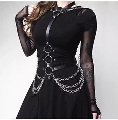 Make a bold statement with this black punk loose chain pu leather harness. With its edgy design, this body harness is perfect for adding a punk flair to your wardrobe. The faux leather and metal details give this harness a steampunk look that will stand out from the crowd. Wear it with a dress or over a long-sleeve shirt for a unique statement look. Shop now and add this stylish piece to your wardrobe! Harness Outfit, Punk Street Style, Chain Harness, Goth Outfit, Black Punks, Body Harness, Estilo Punk, Leather Harness, Gothic Outfits