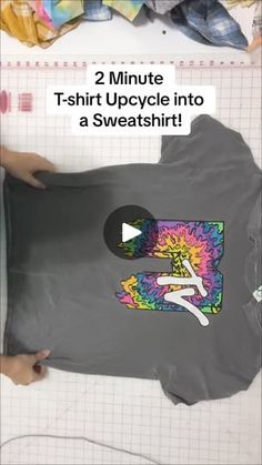 someone is cutting out a t - shirt with the words, 2 minute tshirt upcycling into a sweatshirt