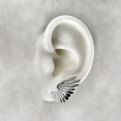 Wearing these Angel Wing Earrings serves as a reminder that guardian angels watch over us, offering protection and guidance. Let the ethereal beauty of the angel wings inspire you and add a touch of grace to your everyday life. Whether you wear them as a personal talisman or as a symbol of faith, these earrings will uplift your spirits and ignite a sense of connection to the divine. Each wing measures 2.5cm. Material : 925 Sterling Silver, 24k Gold Plate. Each piece is handmade to order in the Jewel Thief Brighton atelier. Handmade Silver Wing-shaped Earrings, Pierced Winged Earrings As Gift, Elegant Silver Winged Earrings, Silver Wing-shaped Earrings, Elegant Metal Wing-shaped Earrings, Elegant Wing-shaped Metal Earrings, Angel Wings Gold, Memento Mori Ring, Angel Wings Jewelry