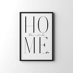 a framed black and white poster with the words,'there is no place like home '