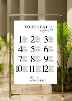 the seating chart for an event is displayed in front of a potted palm tree