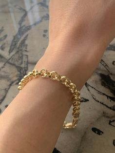 5.5 grams Bracelet lengt: 9 inches Bracelet width: 0.40 14K Gold Thick Chain Bracelet Let's Stay Connected FOLLOW ME ON INSTAGRAM FOR SPECIAL DEALS AND GIVEAWAYS Instagram Link : https://www.instagram.com/noiconejewellry/ ABOUT US I founded Noicone Jewellery, Istanbul based jewellery brand, in 2020. Why? Because, I wanted to make something unique, innovative, creative, permanent, and fascinating.  I tried to gather my ambitions, ideas, skills at the same place. I wanted to share my style, creativity, and vision with a big audience and I tried to make all of these in my brand. I have tried to bring together every product I sell in this brand with my hands and mind in a common way and present them all in a way that is unique and unique in the world. My only goal here is to make the people wh Minimalist Oval Bracelets For Everyday Wear, Minimalist Oval Jubilee Bracelet, Oval Bracelet With Adjustable Chain For Everyday, Oval Adjustable Chain Bracelet For Everyday, Minimalist Oval Chain Bracelet Gift, Minimalist Tarnish Resistant Oval Bracelets, Everyday Oval Gold Chain Bracelet, Minimalist Oval Cable Chain Bracelets, Minimalist Oval Bracelets With Cable Chain