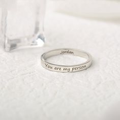 This skinny personalized name ring is perfect for everyday wear. The Minimalist style design. There are available in silver, gold, and rose gold. Also, this customized name ring can be engraved however you desire Type your names, initials or inspirational words to design it, make your rings unique and show off your personality. Suitable for all kinds of occasions, wedding bridesmaid ring, birthday best friend ring, anniversary ring... And it also will be unique gift for your beloved ones or for Meaningful Adjustable Rings With Custom Name, Silver Stackable Rings With Custom Name For Gift, Custom Name Engraved Sterling Silver Ring Gift, Personalized Name Sterling Silver Stackable Rings, Sterling Silver Stackable Name Rings Gift, Best Friend Ring, Birthday Best Friend, Bridesmaid Ring, Word Ring