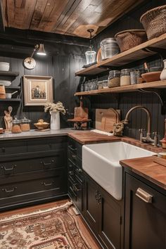 a kitchen with black cabinets and wooden shelves