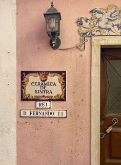 a sign on the side of a building that says cramica sintra ret d'ernando it