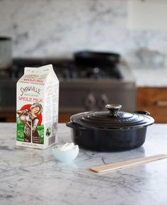 ingredients for making chocolate fudges on a marble countertop in a kitchen setting