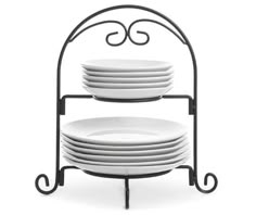 a stack of white plates sitting on top of a metal stand with black iron frame