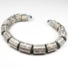 a bracelet made out of newspaper strips