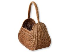 a brown wicker bag with handles on the front and side, against a white background