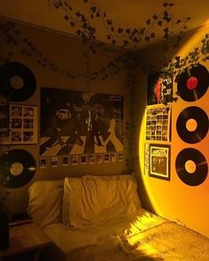 a living room with vinyl records on the wall