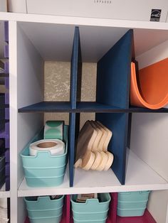 the shelves are filled with different types of storage baskets and containers for crafting supplies