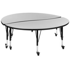 a round table with four wheels on each side and an oval top, in black and white