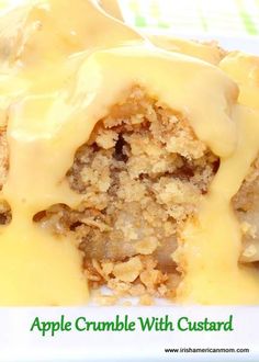 an apple crumble with custard on top is sitting on a plate