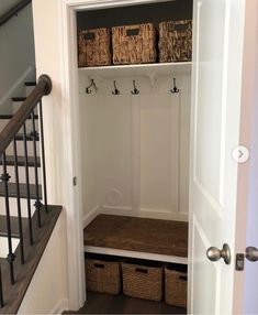 an entry way with some baskets in it