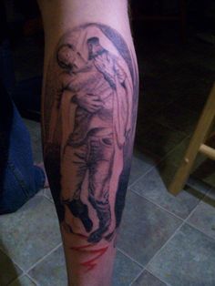 a person with a tattoo on their leg