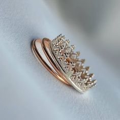 Dainty Stacking Set Of Rings. Sterling Silver Crown Ring. 14K Rose Gold Stacking Bands. Index Finger Rings. Minimalist Jewelry Gifts.  ▪︎  ▪︎  ▪︎  ▪︎  ▪︎  ▪︎  ▪︎  ▪︎ This beautiful set of stacking rings includes 3 rings in total.  x1 Crown Ring (sterling silver) x2 14K Rose Gold Filled Bands.  ▪︎  ▪︎  ▪︎  ▪︎  ▪︎  ▪︎  ▪︎  ▪︎ Please select your desired size from the drop-down menu during checkout.  More beautiful jewelry is available in my shop at: www.zyanyadesignz.etsy.com Silver 14k Rose Gold Ring As Gift, Silver-colored 14k Rose Gold Rings As Gift, Crown Ring Stacking, Rose Gold Crown Design Ring As Gift, Rose Gold Crown Design Promise Ring, Rose Gold Ring With Crown Design, Luxury Silver Tarnish-resistant Stackable Rings, Elegant Sterling Silver Crown Ring, Sterling Silver Crown Design Ring