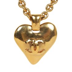 This Chanel Vintage Gold CC heart necklace features a statement heart interlocking CC logo pendant, a thick rolo chain, and a spring ring closure and 24K gold plated hardware. Origin: FranceCondition: Vintage; Excellent - This necklace shows signs of wear on metal including, scratching on pendant and chain and some minor discoloration.Accompanied by: BoxMeasurements: Chain Drop: 12.75", Chain Length: 26", Pendant: 2" x 1.7" Heart Pendant Necklace Gold, Pendant Necklace Gold, Gold Ounce, Madison Avenue, Chanel Vintage, Rolo Chain, Cc Logo, Vintage Chanel, Heart Pendant Necklace