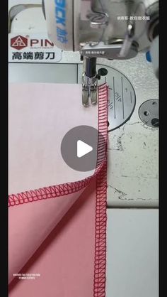 a video demonstrating how to sew on the sewing machine with pink fabric and red stitching