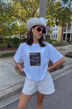 Cowgirls Needs Love Too obviously!! We love this new t-shirt for all fall country concerts coming up. Featuring the cutest white tee with a stamp of Cowgirls Need Love Too on the front. Model is wearing a Medium. Shirt runs TTS, size up for an oversized fit. All sales are final as they are made to order. Fall Country, Country Concerts, White Tee, New T, Need Love, British Indian, The Cutest, Sweater Top, Dress Shop