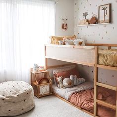 a child's bedroom with bunk beds and toys