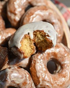 glazed donuts with white glaze on them in a basket