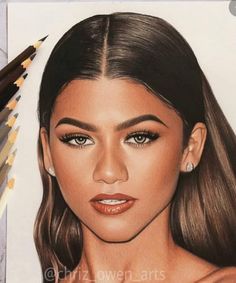 a drawing of a woman's face with long hair and brown eyes is shown next to colored pencils