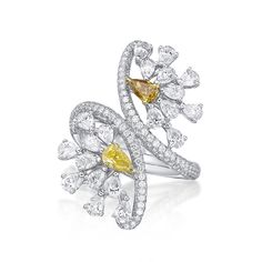 A stunning statement ring featuring 2.81 carats total of round brilliant and pear cut white diamonds of GH/VS quality and 2 Fancy Yellow pear cuts totaling 0.43 carats, all set in 18k gold. 238 diamonds total. Jewelry Design Concept, Fancy Shape Diamond Ring, Pear Shape Earrings, Yellow Diamond Jewelry, Color Diamond Ring, Luxury Diamond Rings, Fancy Diamond Ring, Jewelry Cartier, Yellow Diamond Ring