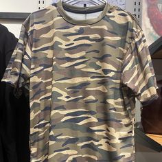 Step up your style game with our Unisex Tiger Stripe Camo T-Shirt. This bold tee features a striking tiger stripe camo pattern, offering a unique twist on the classic camouflage look. Perfect for anyone who loves to stand out, this t-shirt seamlessly blends fashion and comfort. Crafted from soft, high-quality polyester fabric, our t-shirt ensures all-day comfort and durability. The unisex cut provides a relaxed fit for both men and women, making it a versatile addition to any wardrobe. Whether you're hitting the outdoors, heading to a casual event, or just lounging at home, this t-shirt is your go-to choice. Features: Striking Tiger Stripe Camo Design: Features a bold and unique tiger stripe camo pattern, adding an edgy touch to your outfit. Soft and Durable Polyester Fabric: Made from hig Tiger Stripe Camo, Camo Designs, Tiger Stripes, Outdoor Adventures, Step Up, Design Features, Favorite Outfit, Camo, Polyester Fabric