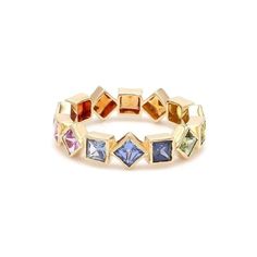 a gold ring with different colored stones