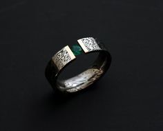 This 6mm wide Stainless Damascus Steel with 18K Yellow Gold and Lab Created emerald Ring has a perfect combination. Stainless damascus steel symbolizes strength and it is also the strong feelings,that is why Damascus is an ideal choice for his and her wedding bands, while also being perfect as a standalone non traditional wedding ring.Each stainless damascus ring is custom made with beautiful and unique pattern, no two rings are alike. Shown 6mm wide, inquire for other stone. SIZES : 8 METAL : Stainless Damascus Steel with 18K Yellow Gold  STONE : Lab Created emerald WIDTH : 6mm FINISH : Polish CONDITION : Brand New PATTERN : Sea Wave All of our stainless Damascus Steel rings are made from corrosion-resistant stainless steel and are 100% rust-proof,it will not corrode like other damascus s Male Ring With Stone, His And Her Wedding Bands, Non Traditional Wedding Ring, Jewelry Rings Unique, Traditional Wedding Rings, Silver Coin Ring, Cool Rings For Men, Damascus Ring, Baby Ring