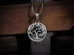 Yggdrasil the world tree necklace pendant for men or women, Engraved futhark runes sterling silver necklace, Scandinavian silver men jewelry Scandinavian sacred Tree of Life - Yggdrasill. This giant ash tree supports the universe, it grows through all the worlds. This sterling silver pendant is refined Yggdrasill's whimsical interweaving of branches and roots symbolizing the commonality of all nine worlds. This beautiful life of tree necklace is made of 925 sterling silver and decorated with spe Symbolic Silver Tree Of Life Jewelry, Symbolic Silver Jewelry With Tree Of Life, Silver Tree Of Life Round Pendant Necklace, Symbolic Sterling Silver Tree Of Life Jewelry, Symbolic Tree Of Life Sterling Silver Jewelry, Spiritual Sterling Silver Jewelry With Tree Of Life, White Gold Tree Of Life Jewelry As Gift, Sterling Silver Tree Of Life Round Pendant, Sterling Silver Tree Of Life Round Pendant Jewelry