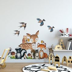 an animal wall decal in a children's room with birds and other animals