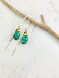 "These one of a kind drop earrings are lightweight and dazzling. Perfect for a night on the town combining comfort and glam. Measuring in at nearly 3\" from top to bottom they are the perfect addition to any outfit. Boho wire wrapping and chain in 14 k gold fill compliment the intense turquoise greens and blues. PLEASE NOTE: While these earrings are custom made from the same gorgeous strand of turquoise they will look a little different. They are carefully wire wrapped especially for you! They a Turquoise Bohemian 14k Gold-filled Earrings, Turquoise 14k Gold Filled Bohemian Earrings, Bohemian Turquoise 14k Gold-filled Earrings, Bohemian Turquoise 14k Gold Filled Earrings, Turquoise Gold Bohemian Earrings, Green Bohemian 14k Gold Filled Earrings, Turquoise 14k Gold Filled Earrings, Turquoise Wire Wrapped Teardrop Dangle Earrings, Turquoise 14k Gold Filled Drop Earrings