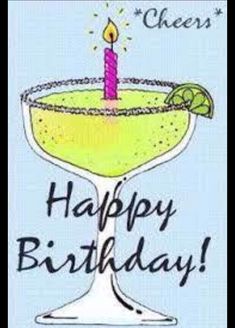 a happy birthday card with a margarita drink and a lit candle on the top of it